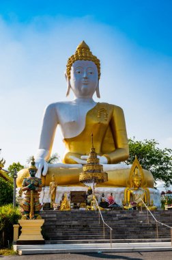 White Buddha statue of Phra That Doi Kham temple, Chiang Mai province.