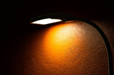 The lamp with orange wall, Thailand.