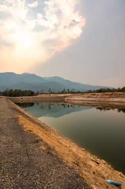 Reservoir with mountain view in Chiang Mai province, Thailand.