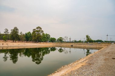 Reservoir with tree reflection in Chiang Mai province, Thailand.