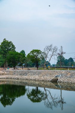 Reservoir with tree reflection in Chiang Mai province, Thailand.