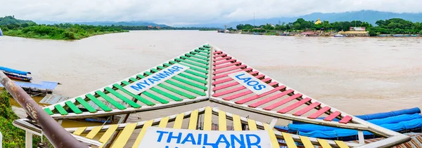 CHIANG RAI, THAILAND - July 18, 2020 :  The Sign of Golden Triangle with Mekong River View at Chiang Saen District, Chiang Rai Province.