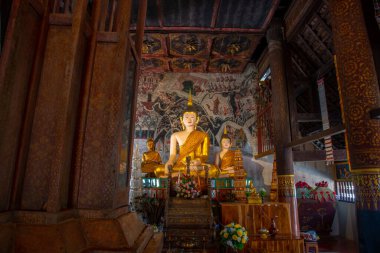 Beautiful Buddha with ancient wall painting in Rong Ngae temple, Thailand.