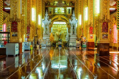LAMPHUN, THAILAND - July 17, 2020 : Beautiful Buddha statue and beautiful church in San Pa Yang Luang temple, Lamphun province.