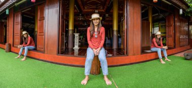 Pamorama of triple Asian women with old building background at Phayao province, Thailand.