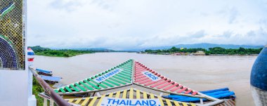 CHIANG RAI, THAILAND - July 18, 2020 :  The Sign of Golden Triangle with Mekong River View at Chiang Saen District, Chiang Rai Province.