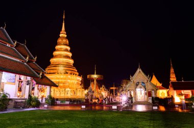 Night scene of Phra That Hariphunchai temple, Lamphun Province.