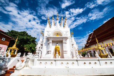 The Pong Sunan temple with clouds in Phrae province, Thailand. clipart