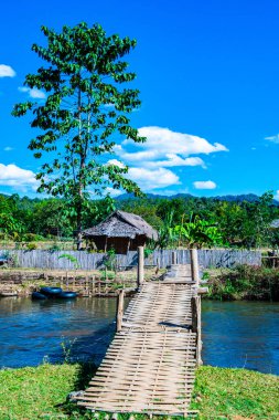 Small canal with mountain in Mueang Khong district, Thailand.