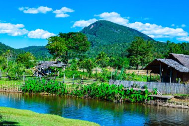 Small canal with mountain in Mueang Khong district, Thailand.