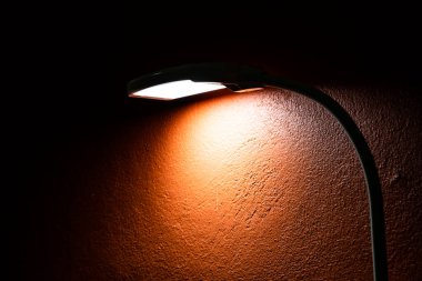 The lamp with orange wall, Thailand.