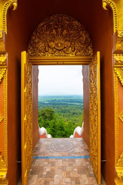Aerial view through door frame at Pra That Doi Pra Chan temple, Lampang province.