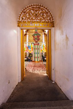 Lanna style door frame of Phra That Hariphunchai temple, Lamphun province.