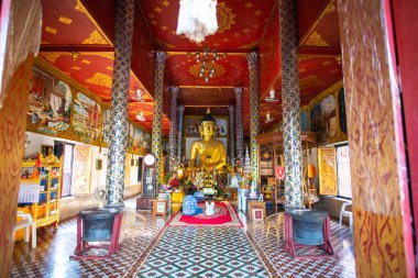 LAMPHUN, THAILAND - October 29, 2019 : Ancient Buddha statue in Phra That Hariphunchai temple, Lamphun province.