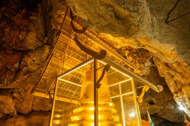 Phra Sabai cave with golden pagoda in Lampang province, Thailand.