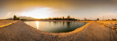 Panorama view of reservoir with mountain view at sunset, Chiang Mai province.