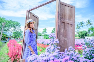 Thai Woman with Beautiful Garden at Chiang Mai Province, THailand.