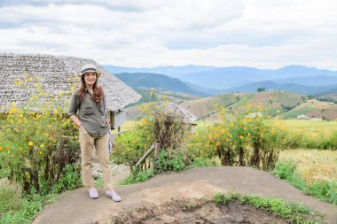 Asian Woman with Pa Bong Piang Rice Terraces at Chiang Mai Province, Thailand.