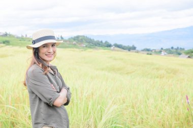 Asian Woman with Pa Bong Piang Rice Terraces at Chiang Mai Province, Thailand.