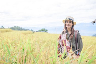 Asian Woman with Pa Bong Piang Rice Terraces at Chiang Mai Province, Thailand.