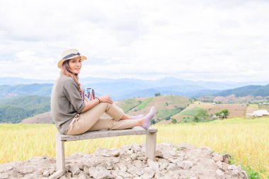 Asian Woman with Rice Field Background at Pa Bong Piang Rice Terraces, Chiangmai Province.