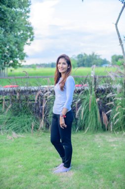 Asian Woman in Park at Phayao Province, Thailand.