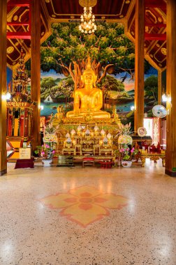 NAN, THAILAND - November 5, 2020 : Old Buddha Statue with Thai Style Church in Prang Temple, Nan Province.