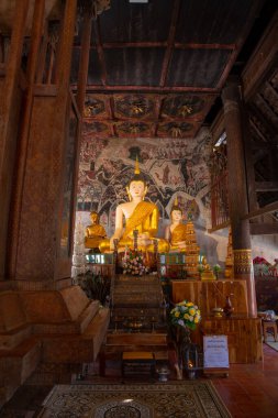Beautiful Buddha with ancient wall painting in Rong Ngae temple, Thailand.