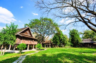 Lanna Traditional Houses with Grass Yard in Chiang Mai Province, Thailand.