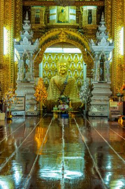 LAMPHUN, THAILAND - July 17, 2020 : Beautiful Buddha statue and beautiful church in San Pa Yang Luang temple, Lamphun province.