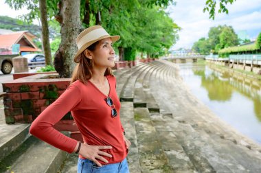 Asian woman at park in Chiang Kham district, Phayao province.