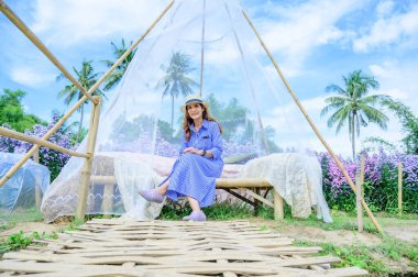 Thai Woman with Beautiful Garden at Chiang Mai Province, THailand.