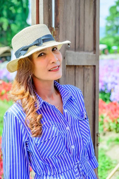 Thai Woman with Beautiful Garden at Chiang Mai Province, THailand.