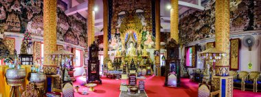 NAN, THAILAND - November 4, 2020 : Panorama View of White Buddha Statue with Beautiful Thai Style Church in Si Mongkol Temple, Nan Province.