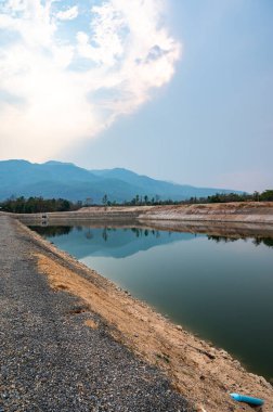 Reservoir with mountain view in Chiang Mai province, Thailand.