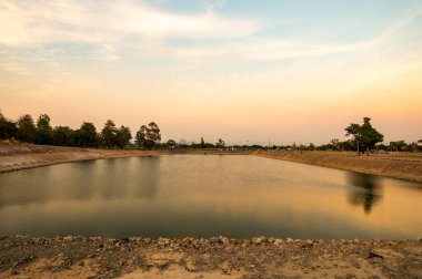 Reservoir with walkway at sunset, Chiang Mai province.
