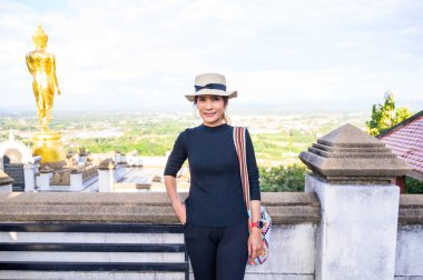 Thai Woman in Black Dress with City View Background, Nan Province.