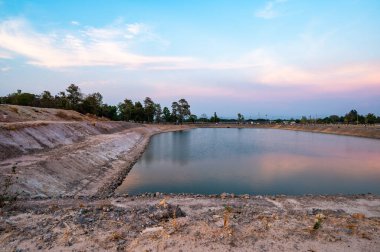 Reservoir with walkway at sunset, Chiang Mai province.