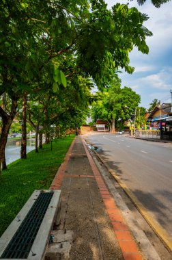 CHIANG MAI, THAILAND - April 26, 2020 : Chaeng Si Phum ancient wall with city street of Chiang Mai province, Thailand.