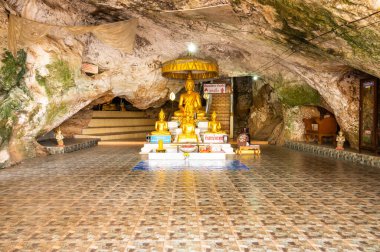 Phra Sabai cave with golden Buddha in Lampang province, Thailand.
