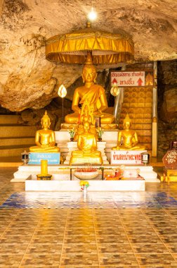 Phra Sabai cave with golden Buddha in Lampang province, Thailand.