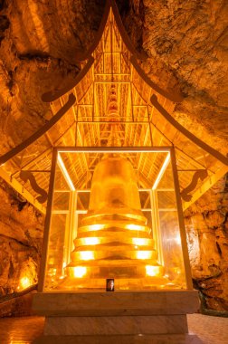 Phra Sabai cave with golden pagoda in Lampang province, Thailand.