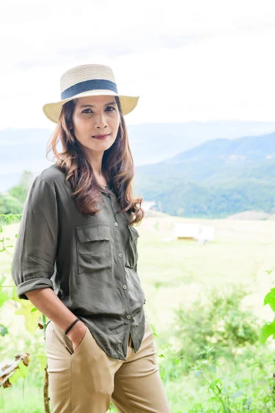 Asian Woman with Pa Bong Piang Rice Terraces at Chiang Mai Province, Thailand.