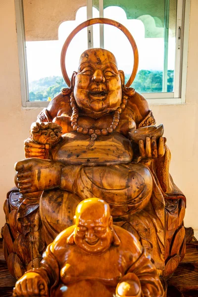 stock image Phra sangkatchai monk statue made from wood in Hyuaplakang temple, Thailand.