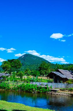 Small canal with mountain in Mueang Khong district, Thailand.