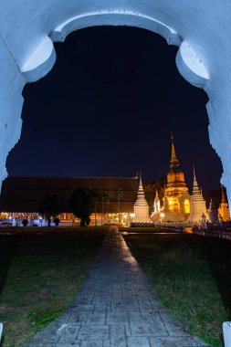 Suan Dok temple with door frame in the night, Thailand.
