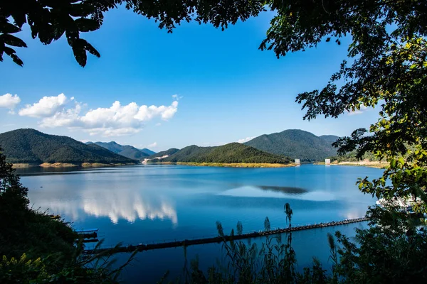 stock image Mae Kuang Udom Thara dam with suspension bridge, Thailand.