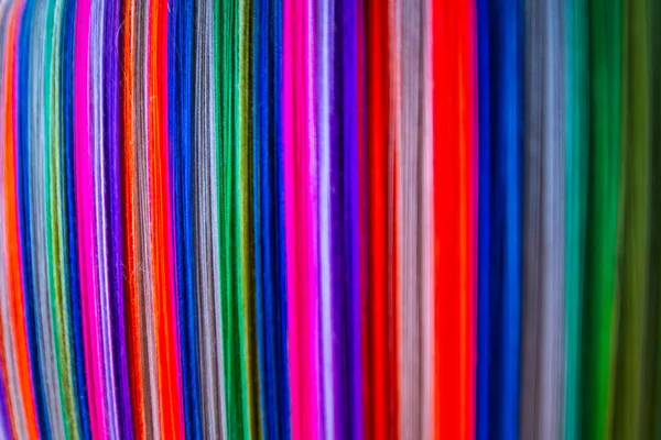 stock image Colourful threads on an ancient wooden loom, Thailand.