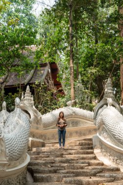 Thai woman with Thai style stair at Luang Khun Win temple, Chiang Mai Province.