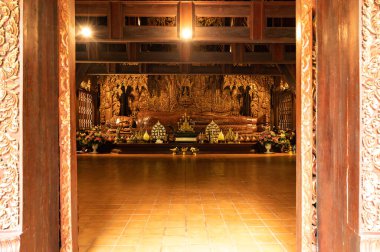 The Wooden Reclining Buddha of Wat Luang Khun Win in Chiangmai Province, Thailand.